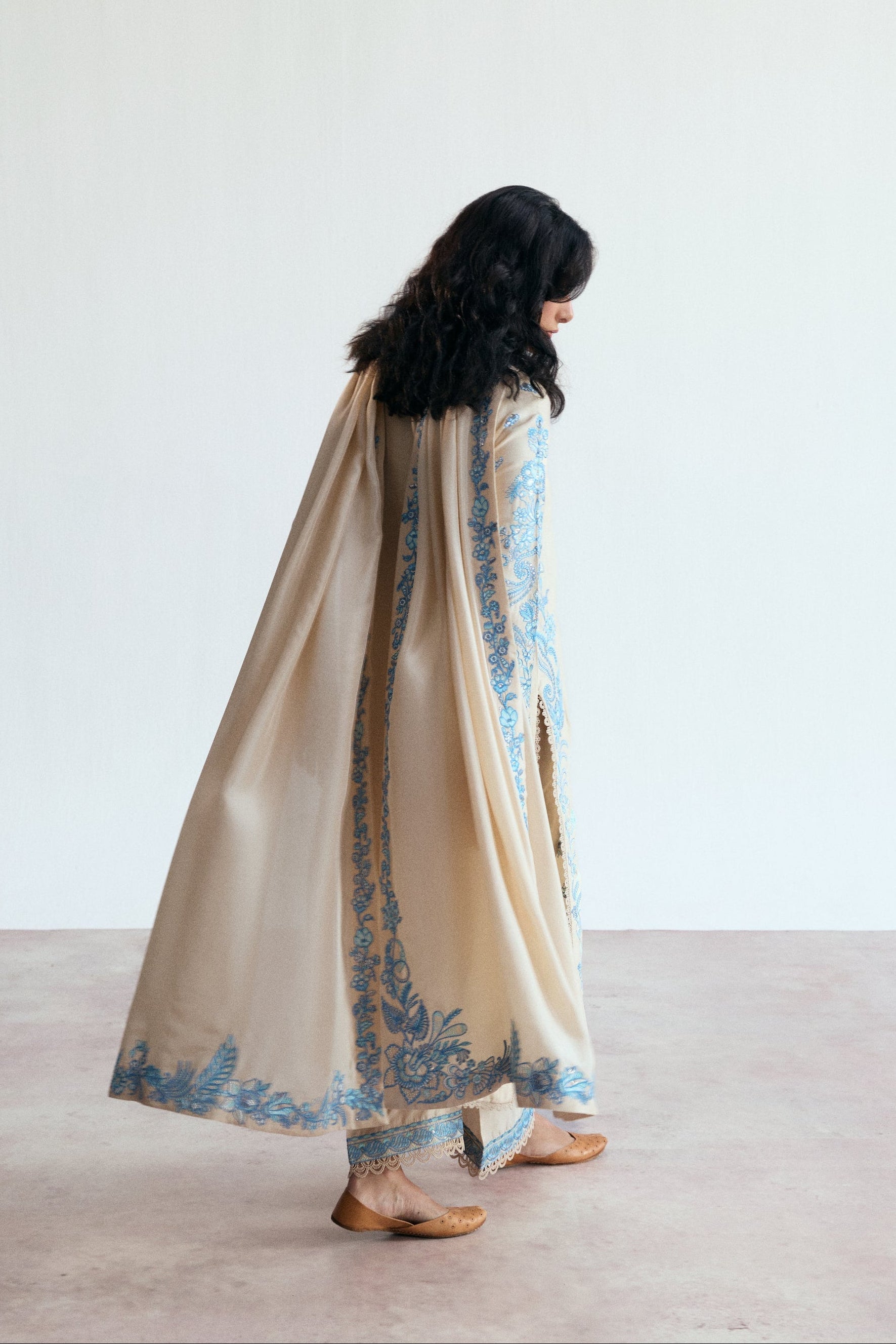 cream three piece pakistani set with blue embroidery. Semi-formal wear. 