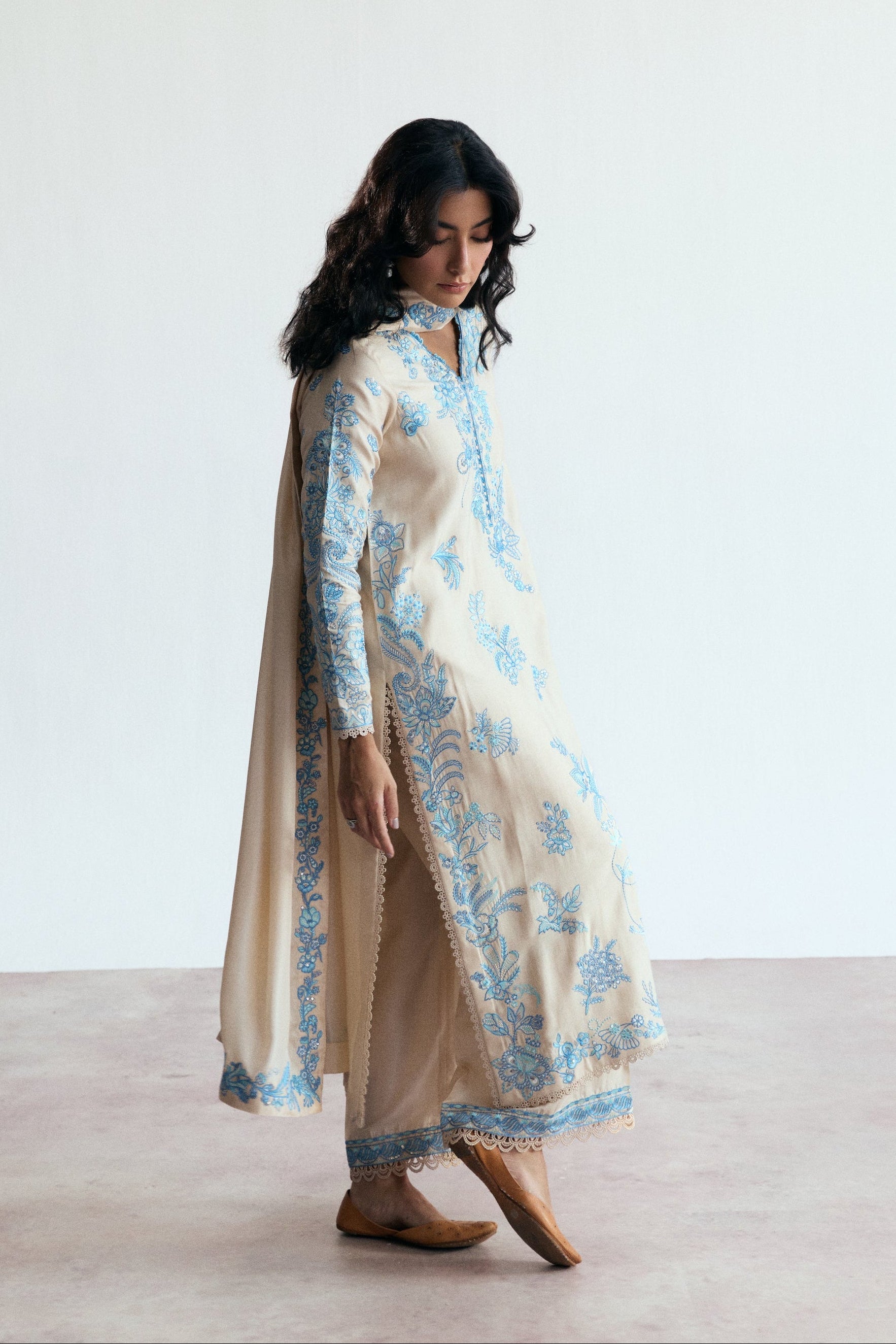 cream three piece pakistani kameez set with blue embroidery. Semi-formal wear. 