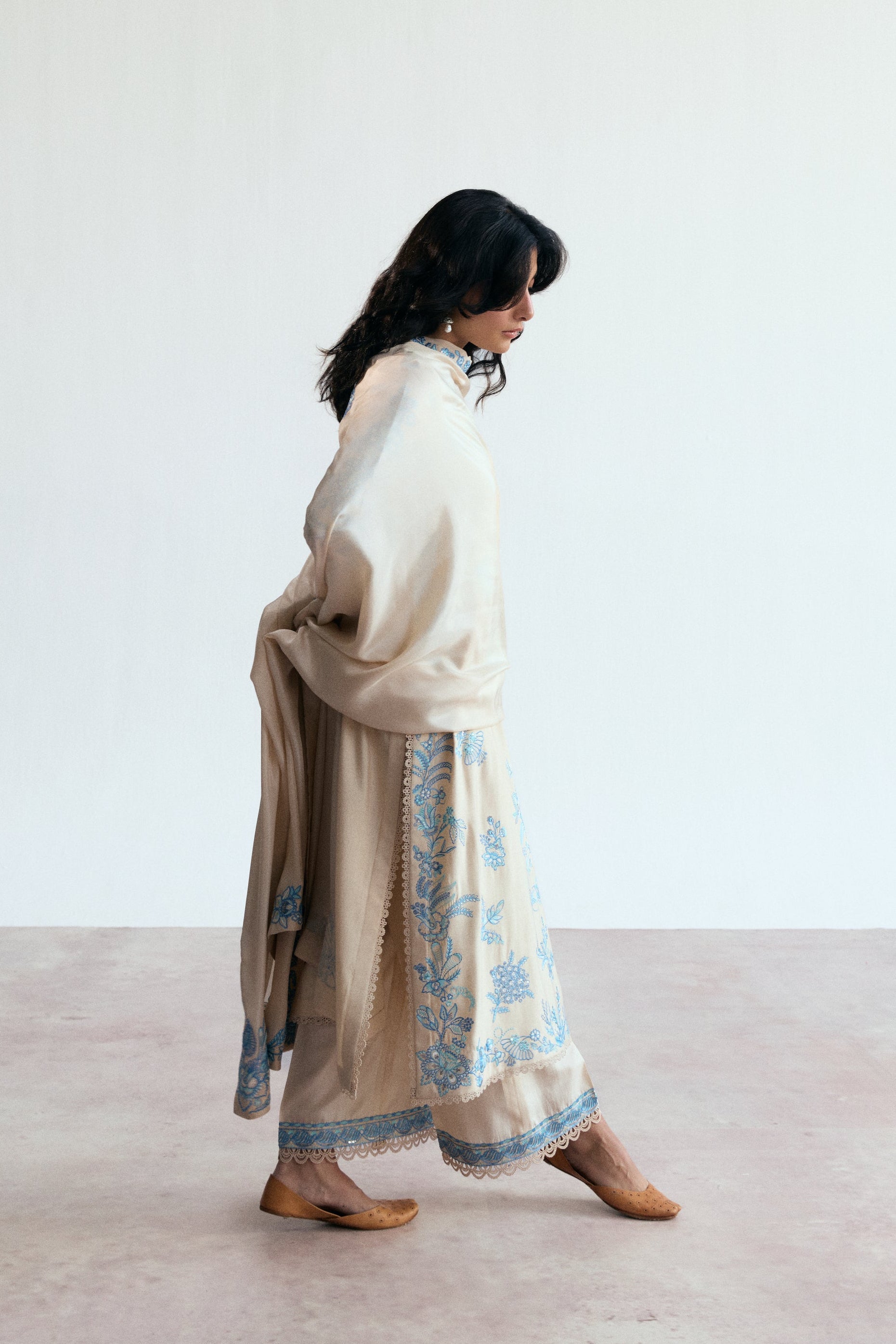 cream three piece pakistani kameez set with blue embroidery. Semi-formal wear. 