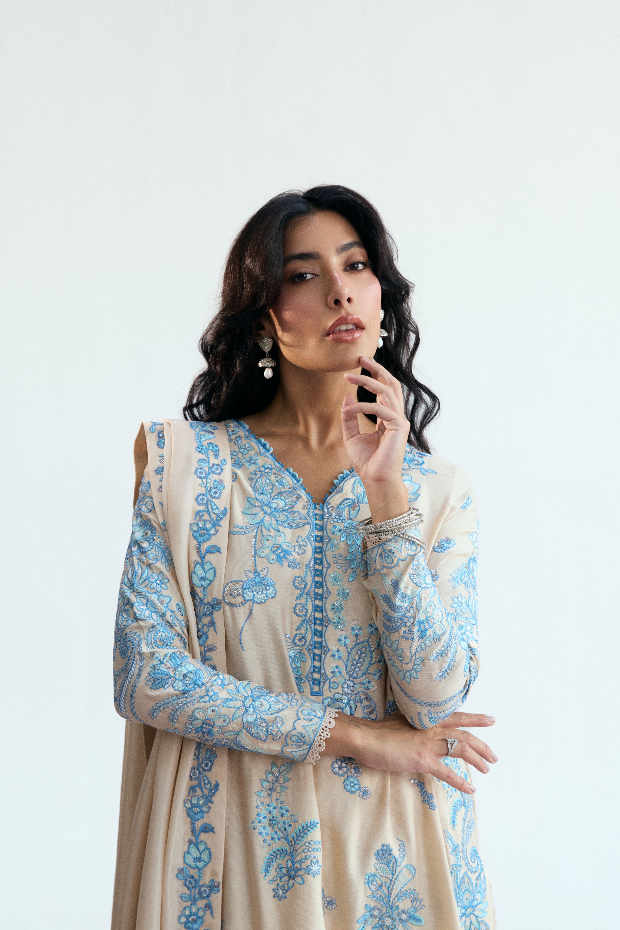 cream three piece pakistani kameez set with blue embroidery. Semi-formal wear. 