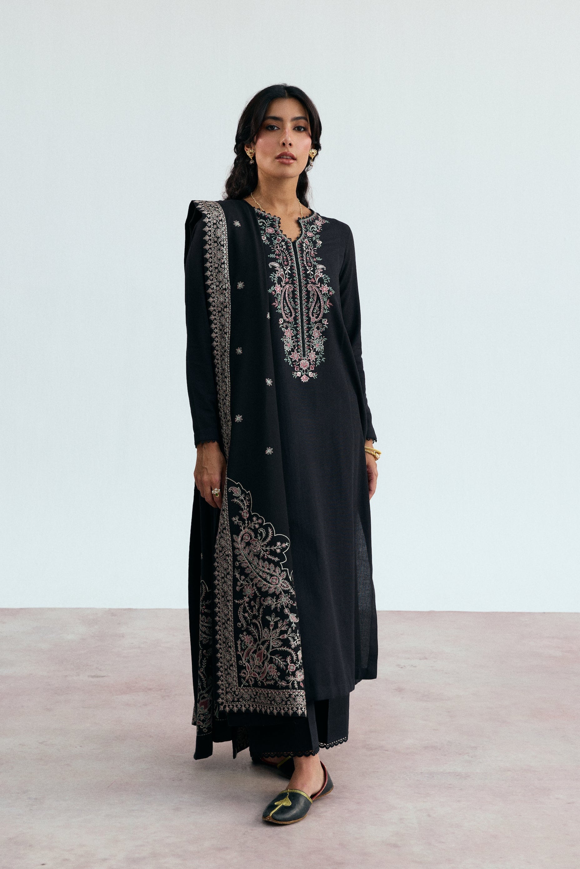 Black Khaddar long kameez with pastel embroidery on keyhole neckline and lace-detailed tapered sleeves – premium Pakistani winter wear
