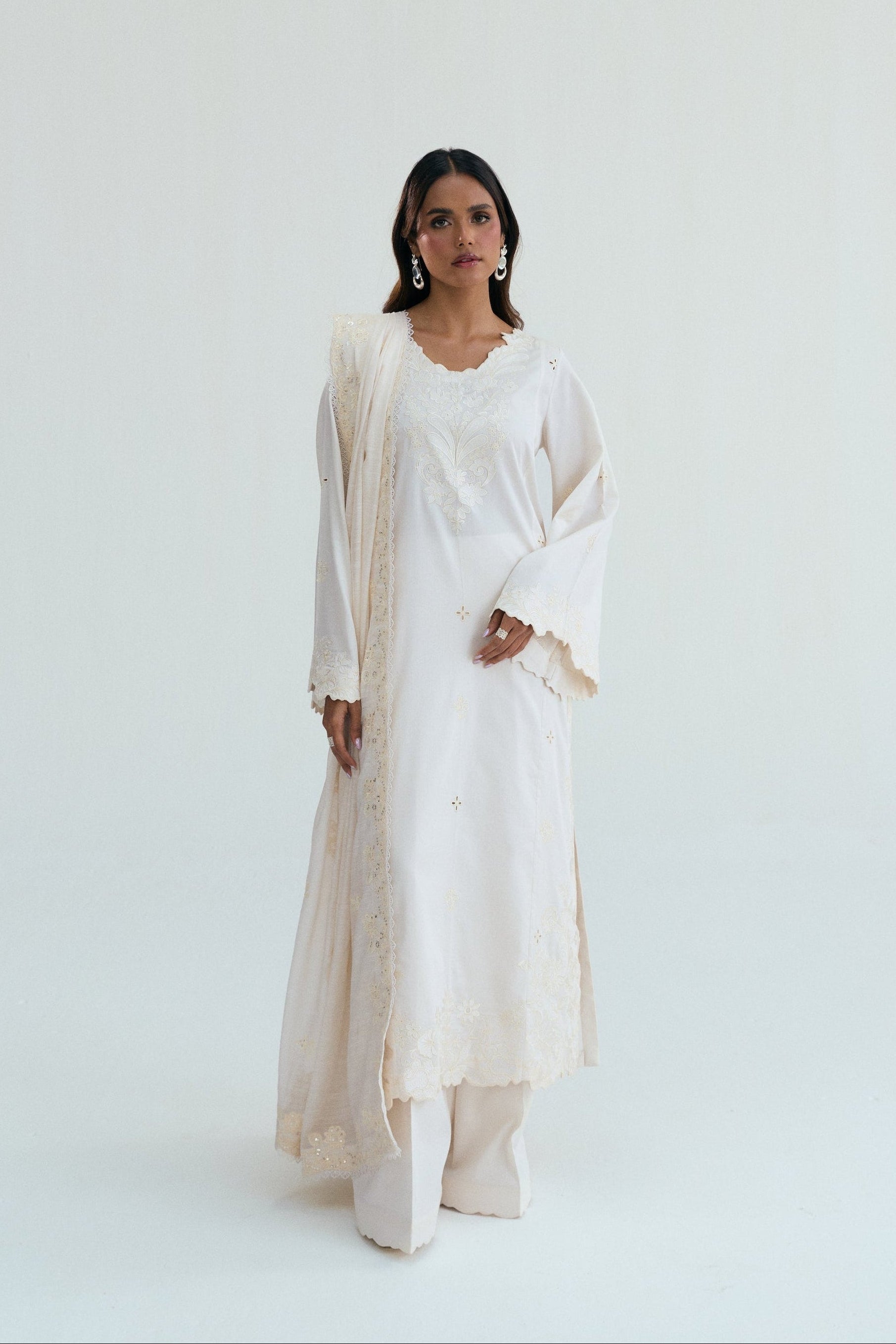 Ivory embroidered long kameez with wide leg trousers Pakistani wedding outfit