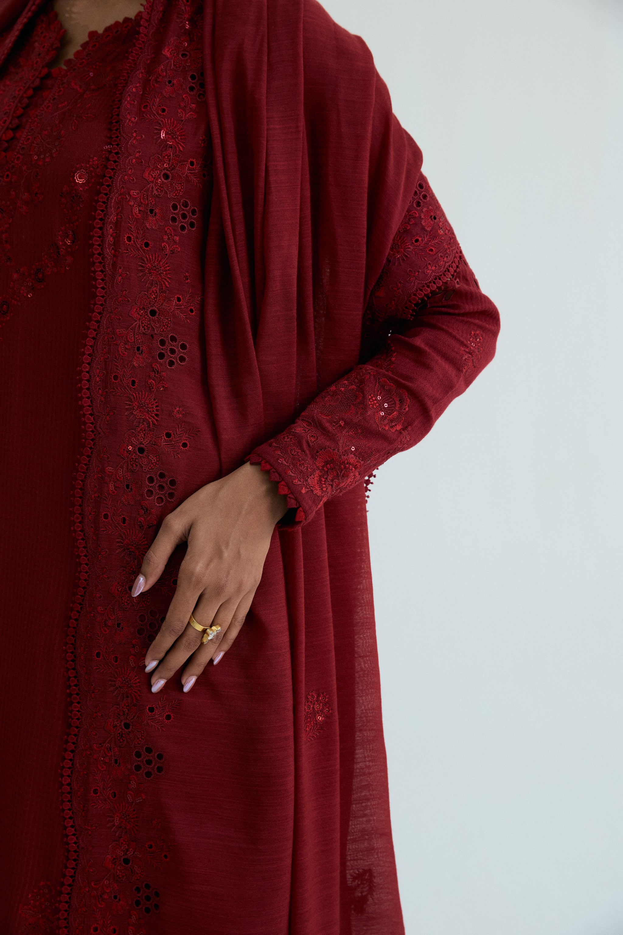 Deep red embroidered Pakistani outfit in dobby cotton with scalloped izaar trousers and slub silk dupatta. Ideal for Eid and festive occasions.