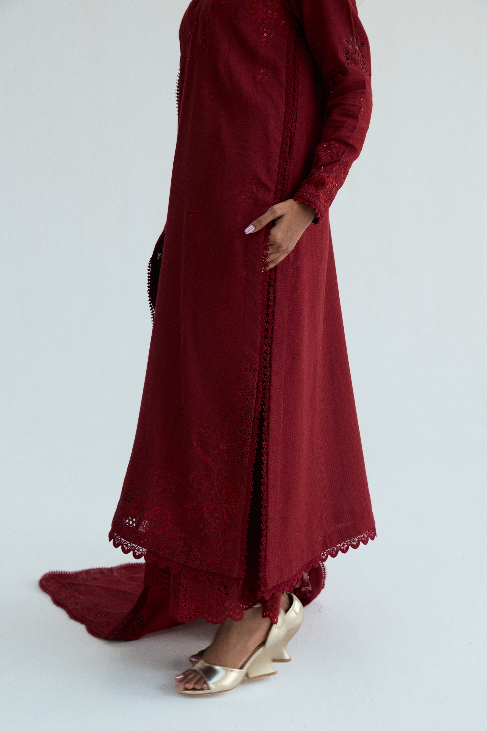 Deep red embroidered Pakistani outfit in dobby cotton with scalloped izaar trousers and slub silk dupatta. Ideal for Eid and festive occasions.