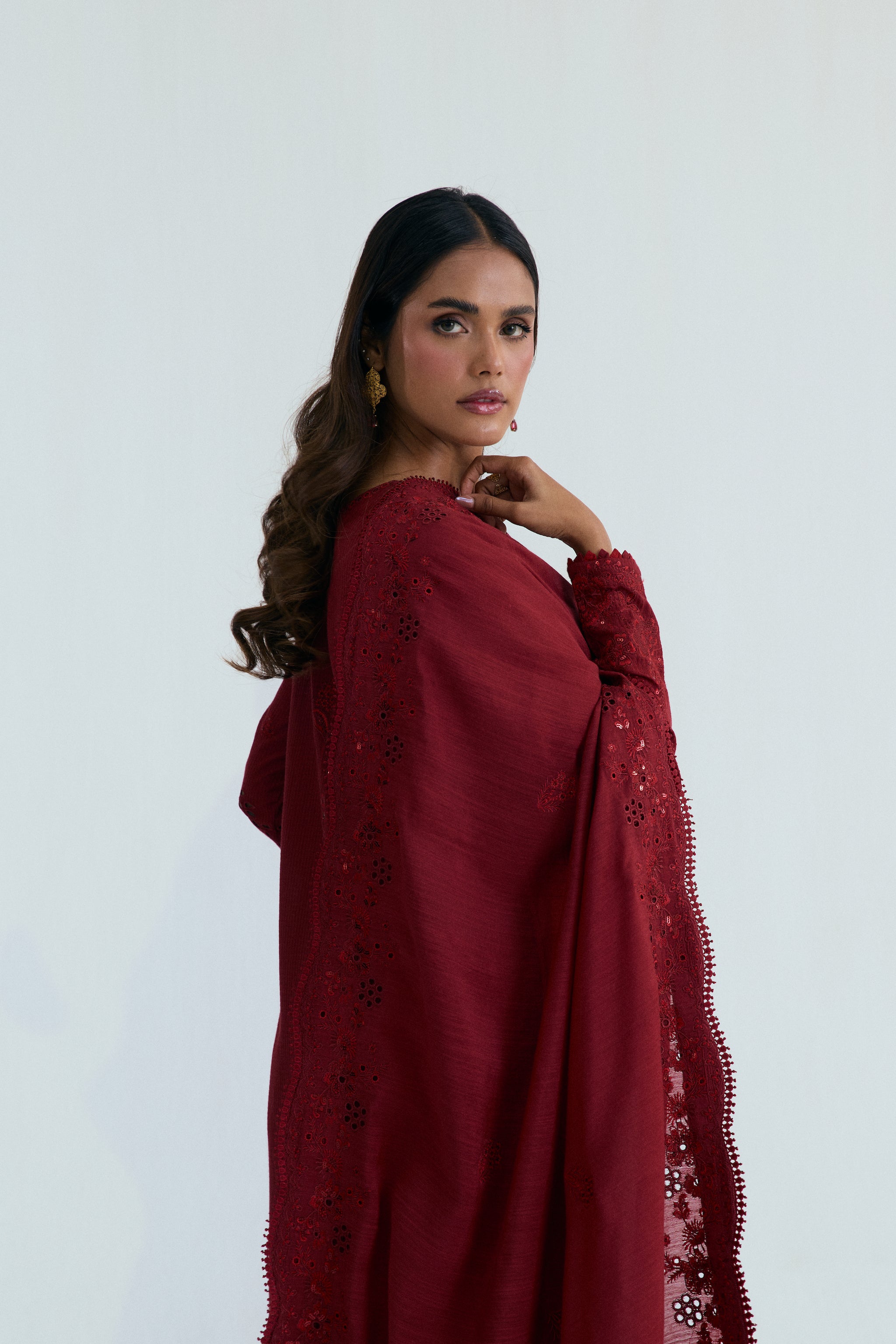 Deep red embroidered Pakistani outfit in dobby cotton with scalloped izaar trousers and slub silk dupatta. Ideal for Eid and festive occasions.