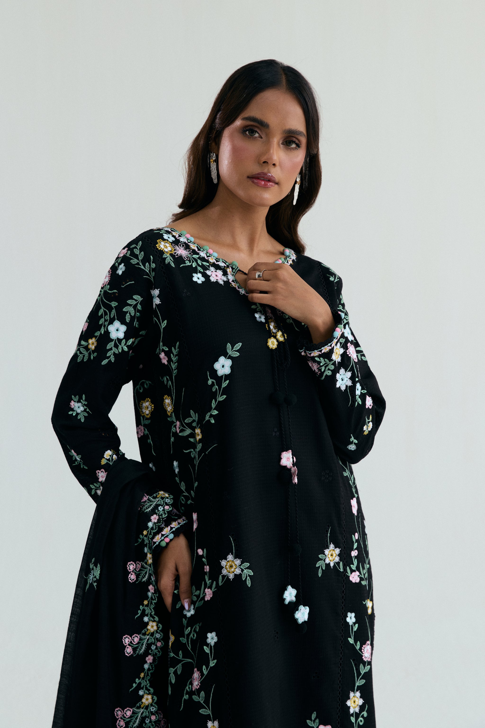  Black Pakistani casual outfit with floral embroidery, embroidered izaar trousers and scalloped dupatta. 
