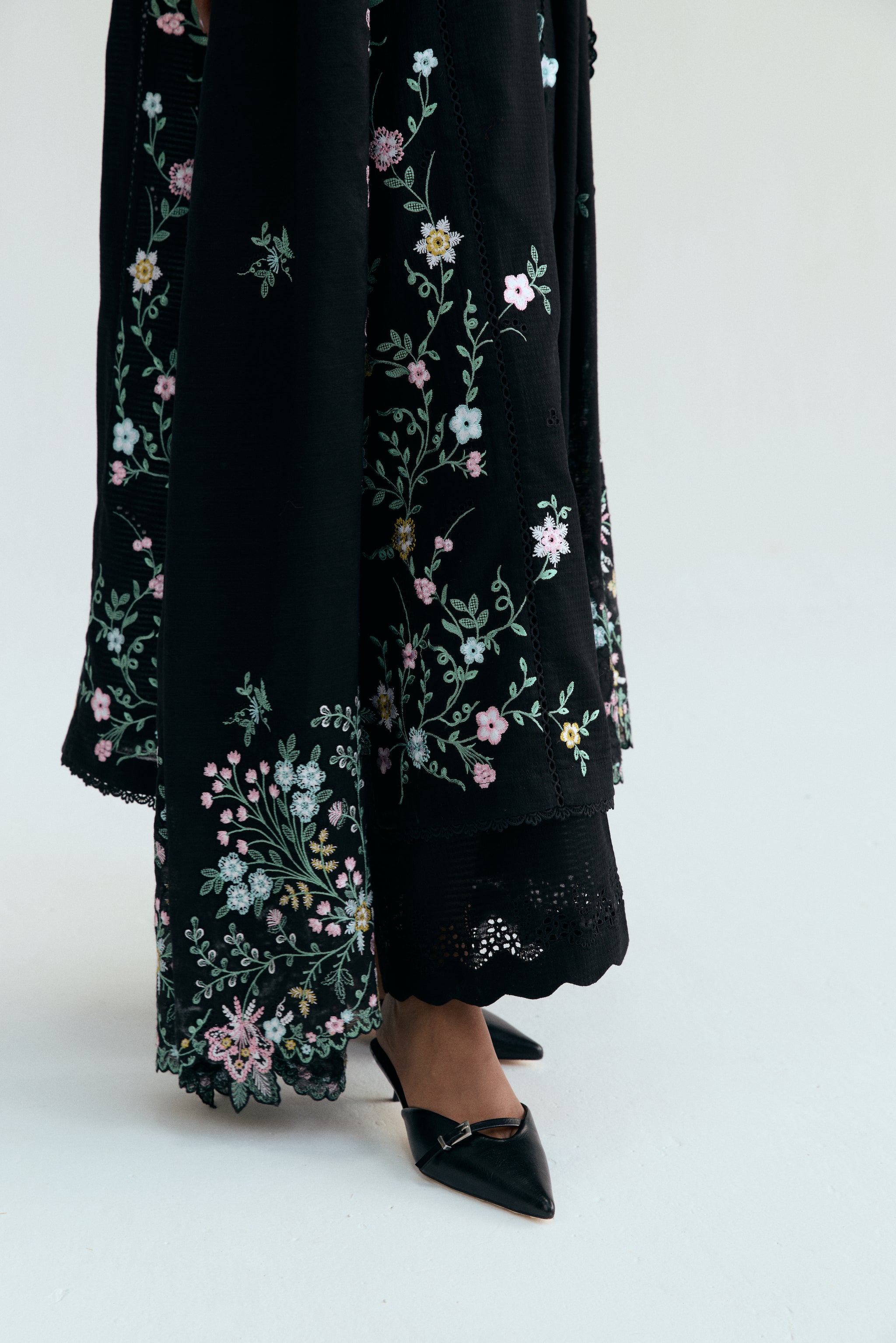 Black Pakistani casual outfit with floral embroidery, embroidered izaar trousers and scalloped dupatta. 