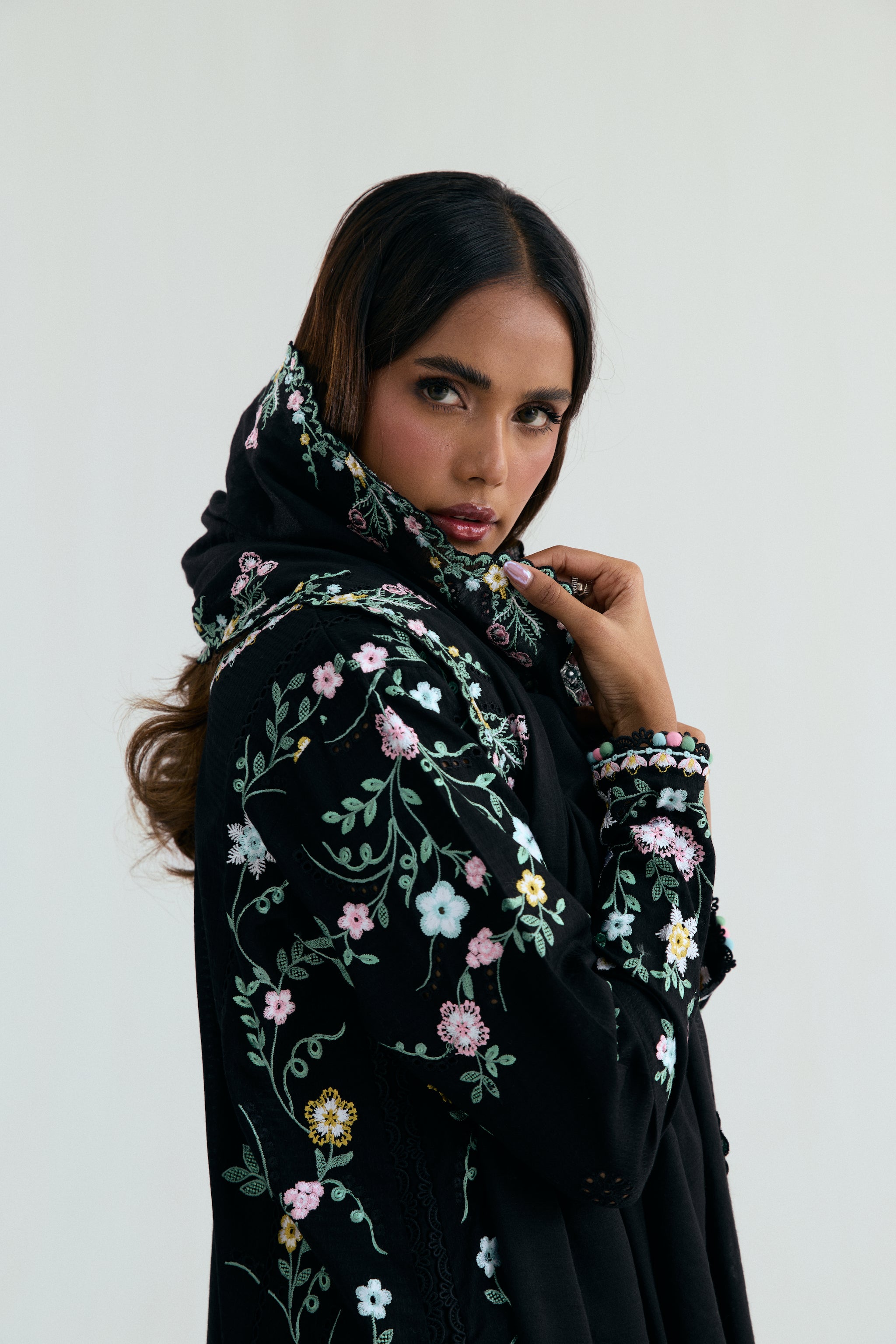  Black Pakistani casual outfit with floral embroidery, embroidered izaar trousers and scalloped dupatta. 