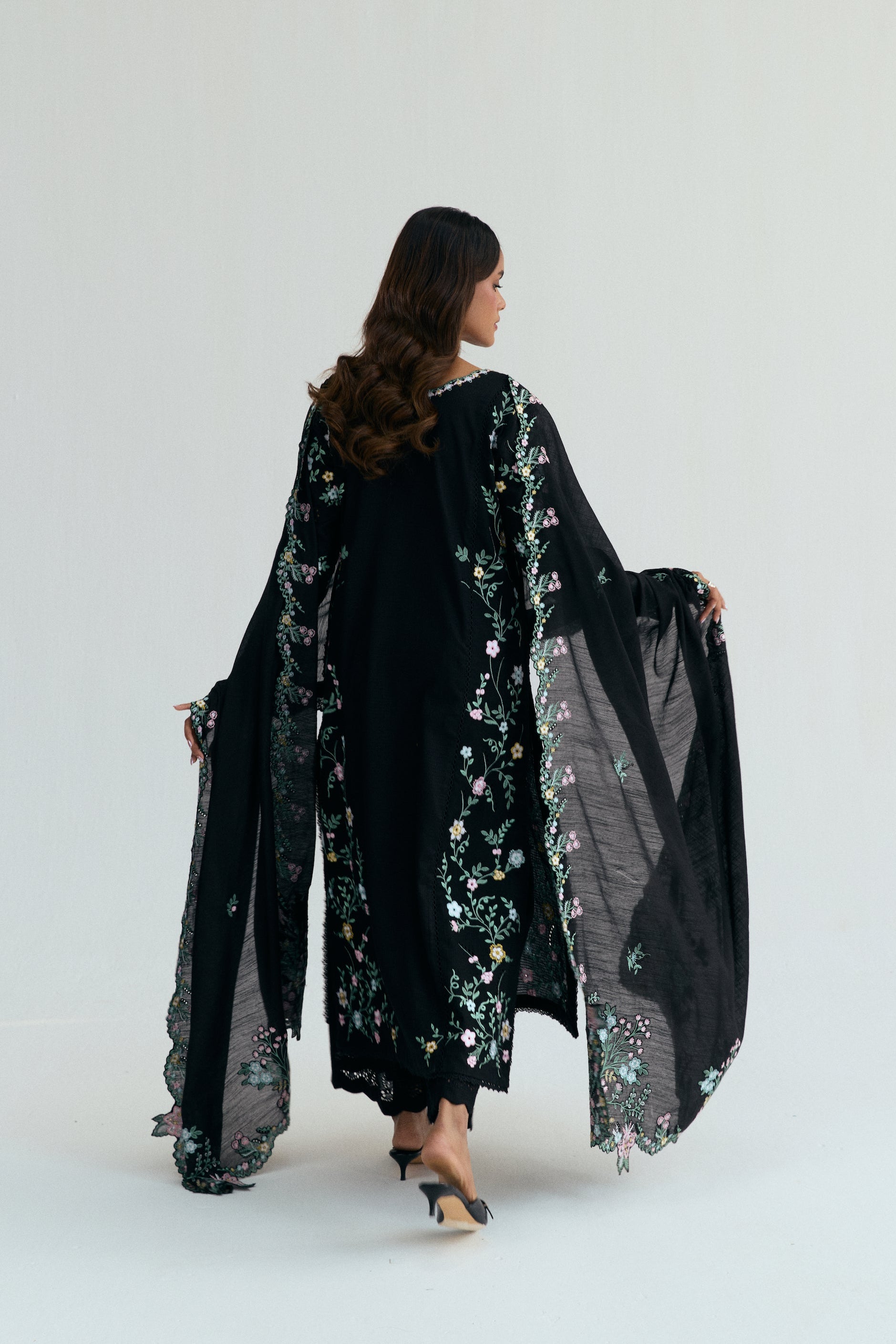  Black Pakistani casual outfit with floral embroidery, embroidered izaar trousers and scalloped dupatta. 