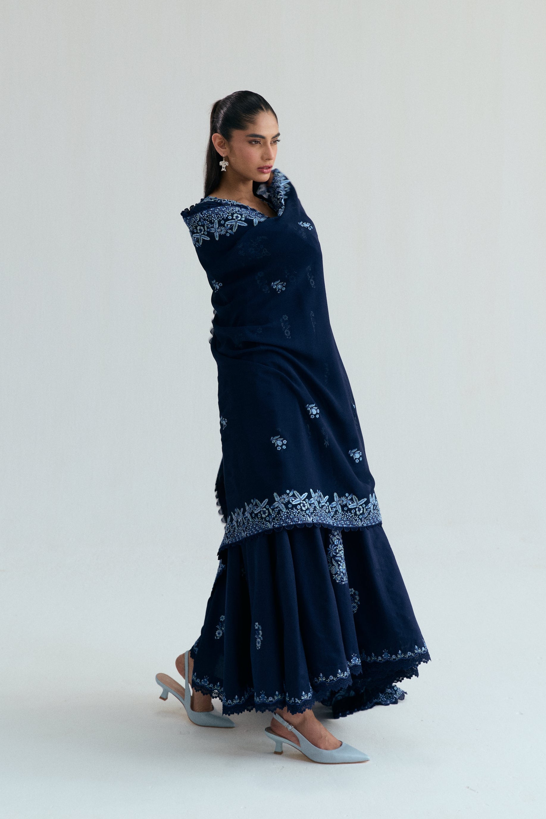 Embroidered Kalidaar frock with organza appliqué, lace-finished trousers and sequin chiffon dupatta. Ideal for Eid and festive occasions.