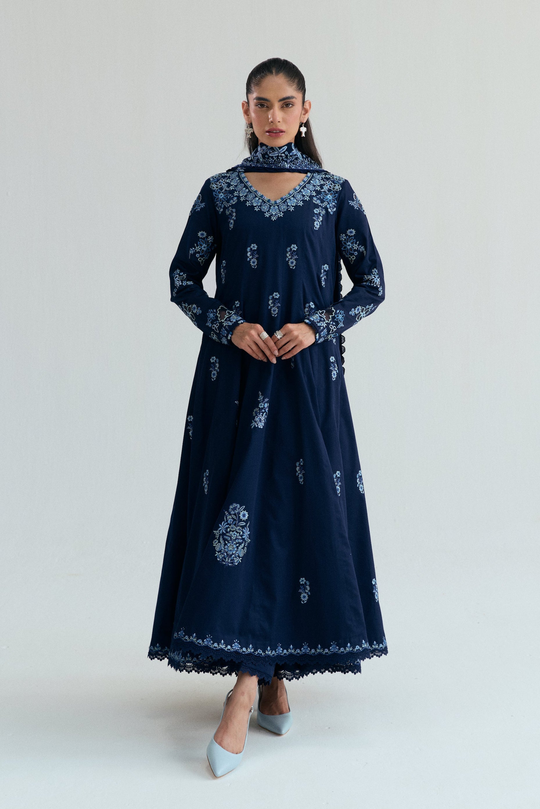 Embroidered Kalidaar frock with organza appliqué, lace-finished trousers and sequin chiffon dupatta. Ideal for Eid and festive occasions.