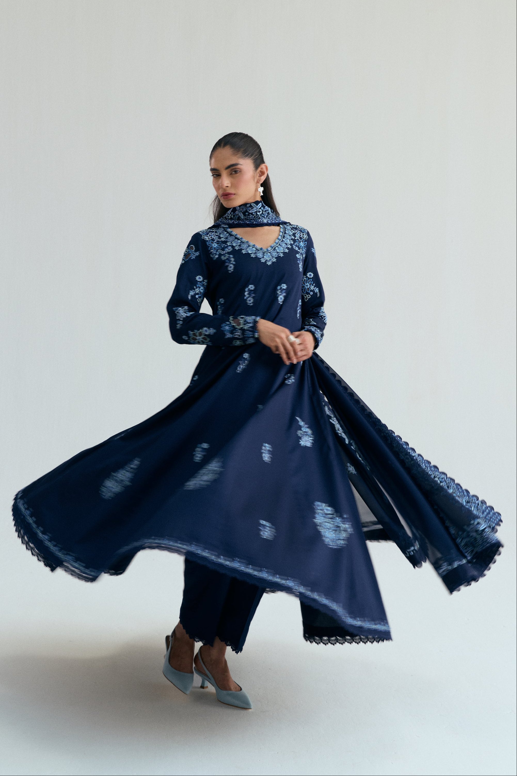 Embroidered Kalidaar frock with organza appliqué, lace-finished trousers and sequin chiffon dupatta. Ideal for Eid and festive occasions.