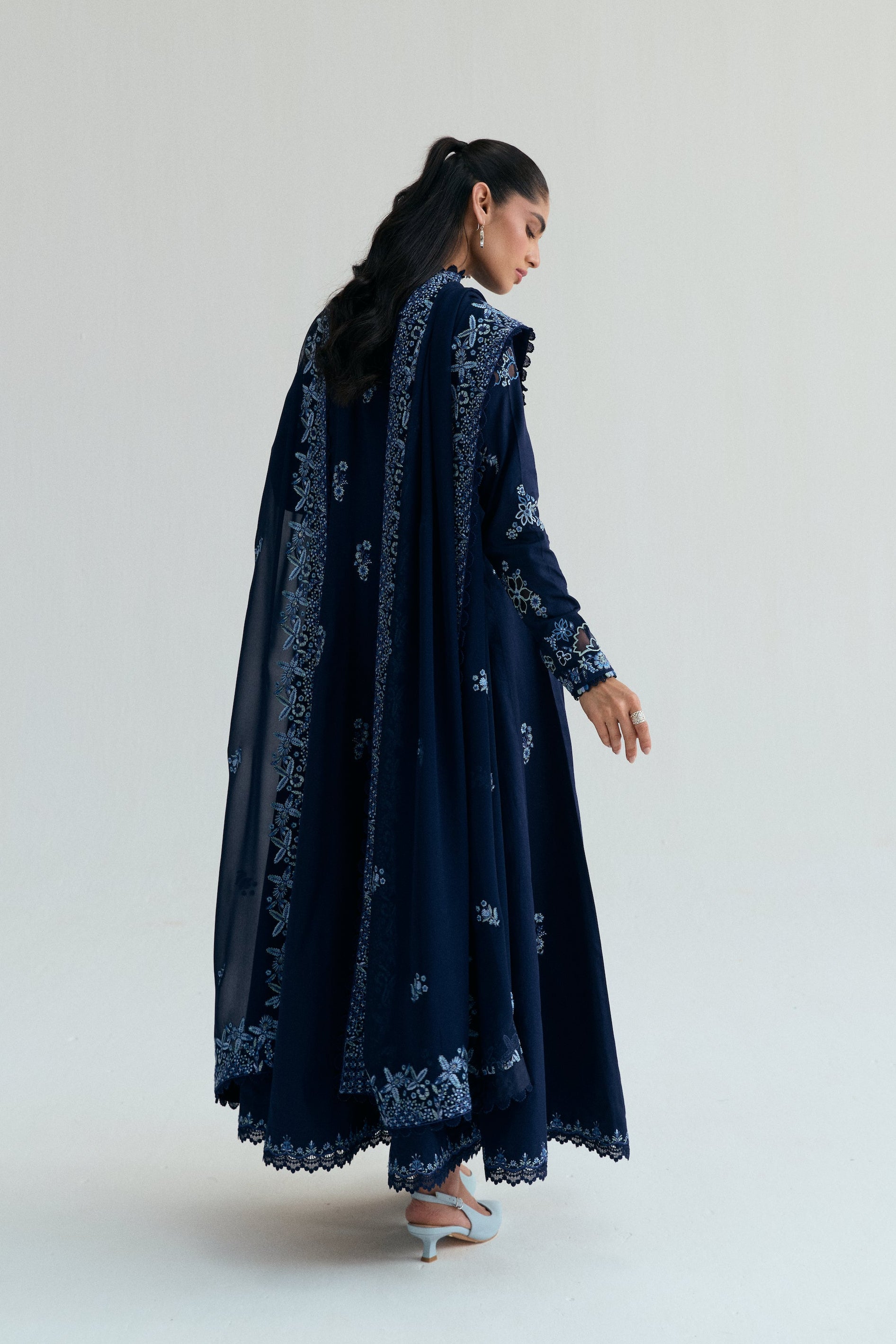 Embroidered Kalidaar frock with organza appliqué, lace-finished trousers and sequin chiffon dupatta. Ideal for Eid and festive occasions.