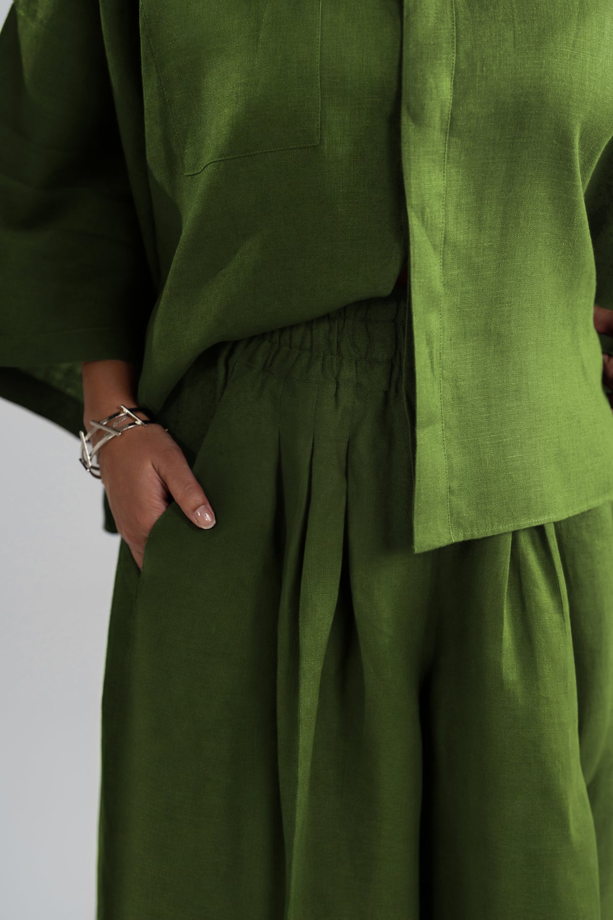 Side pocket detail on Aspen Set high-waisted wide-leg trousers