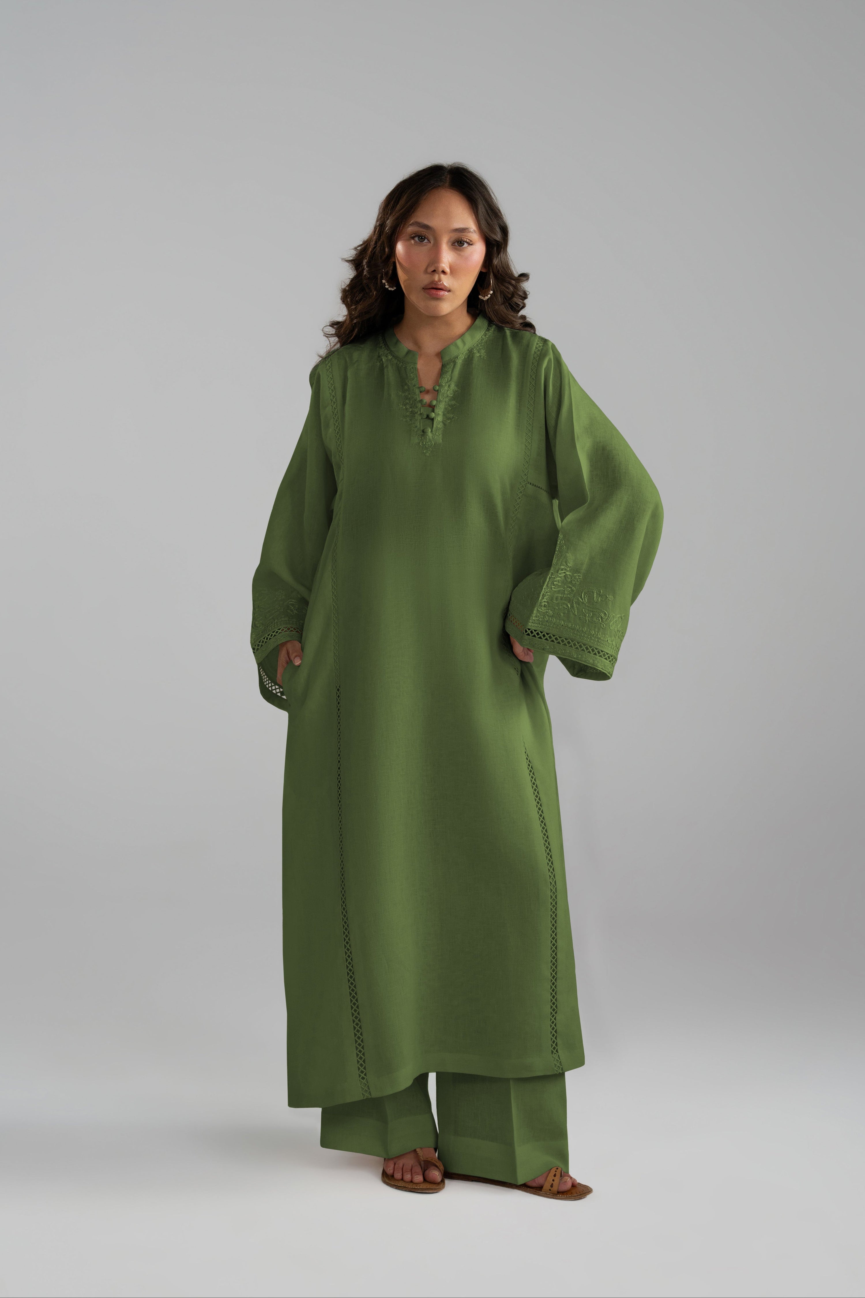 Front view of the Clover Set styled as a green linen tunic and wide-hem trouser set