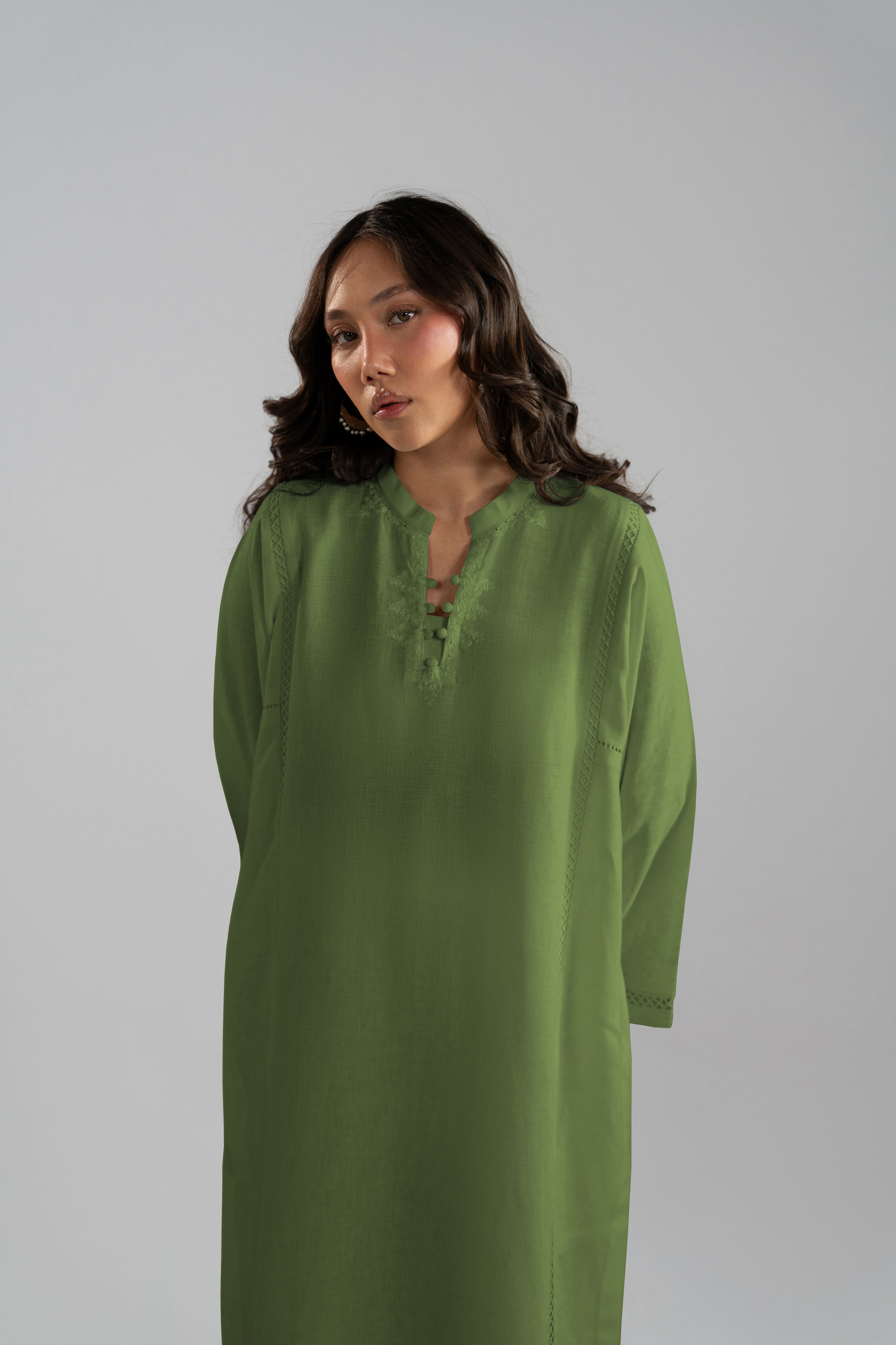 Close front view of the Clover Set, a green linen tunic