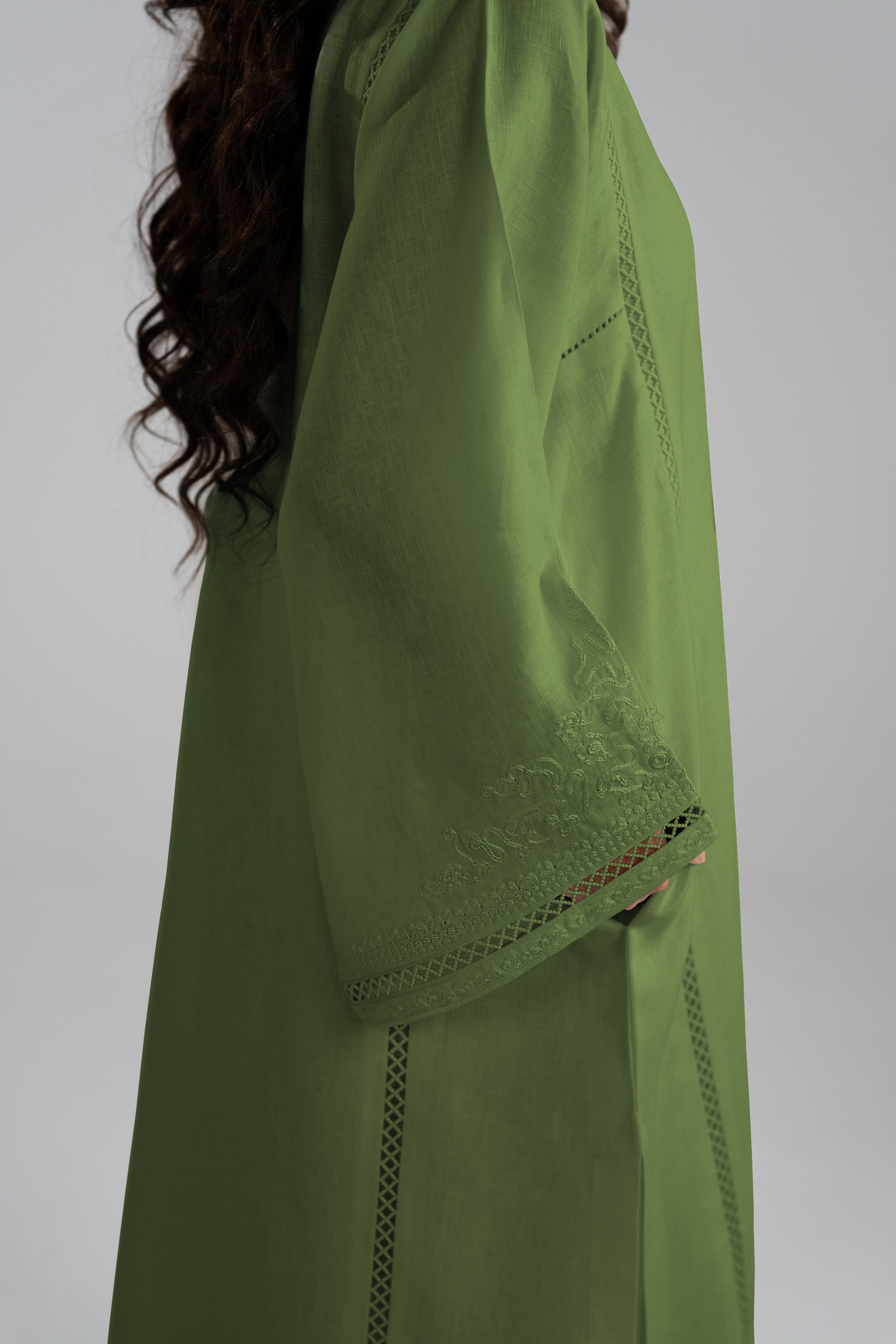 Side view of the Clover Set showing the linen tunic's side seam and hemline