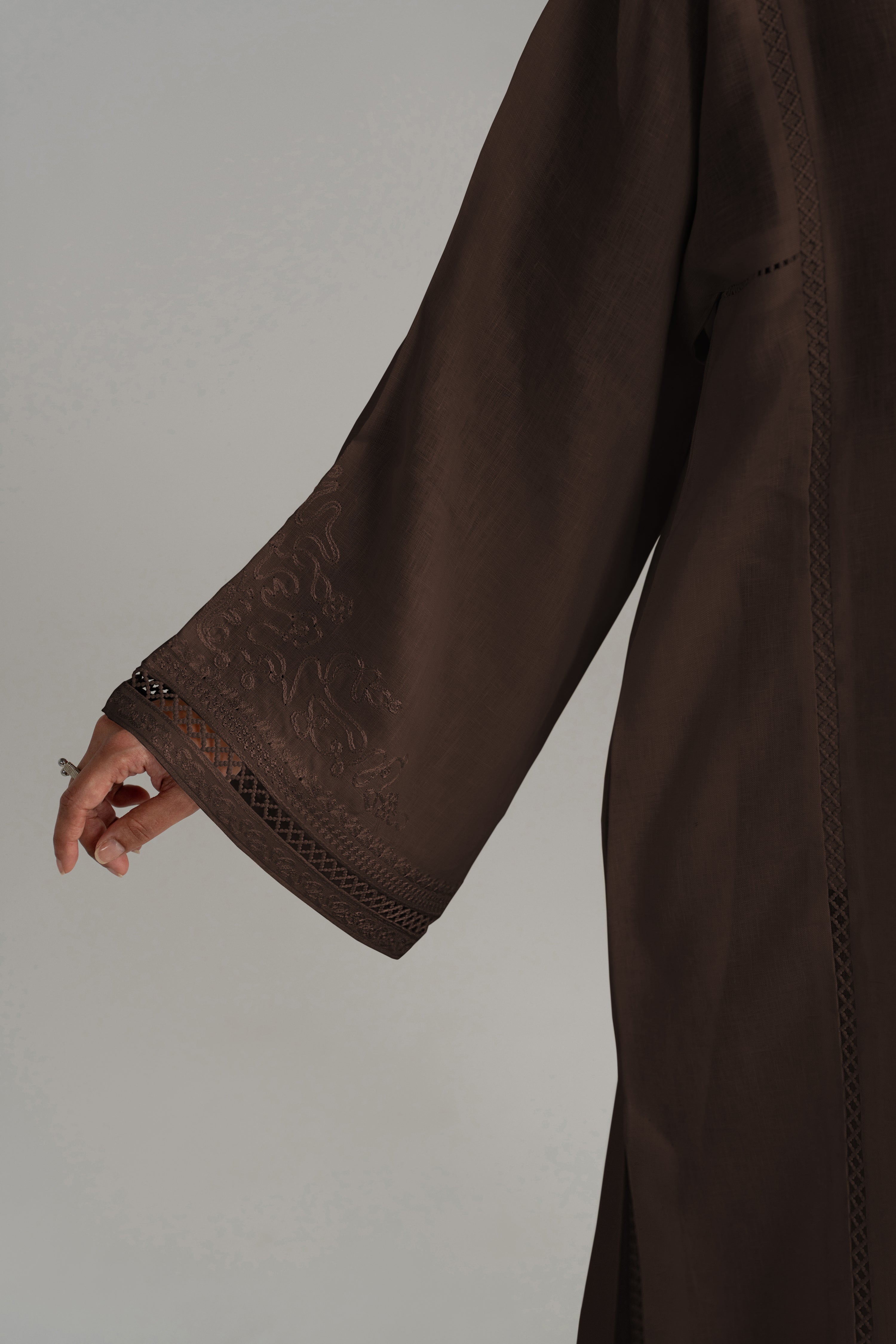 Close-up of the Maple Set's wide bell sleeve and cuff in brown woven fabric