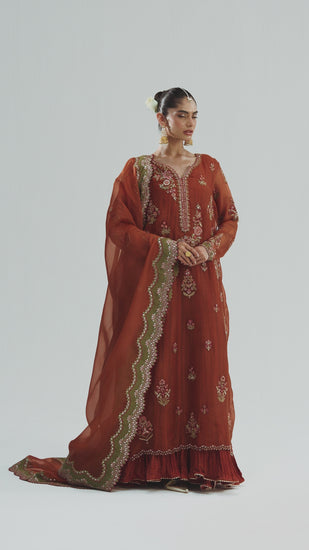 Pakistani wedding guest outfit burnt orange organza dress with embellished tassels