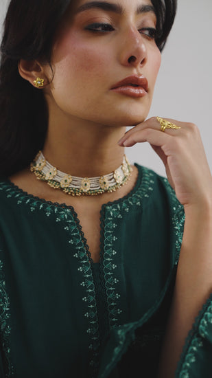 Premium emerald green Khaddar winter ensemble for women – embroidered kameez, farshi salwar, and detailed shawl for casual & semi-formal occasions
