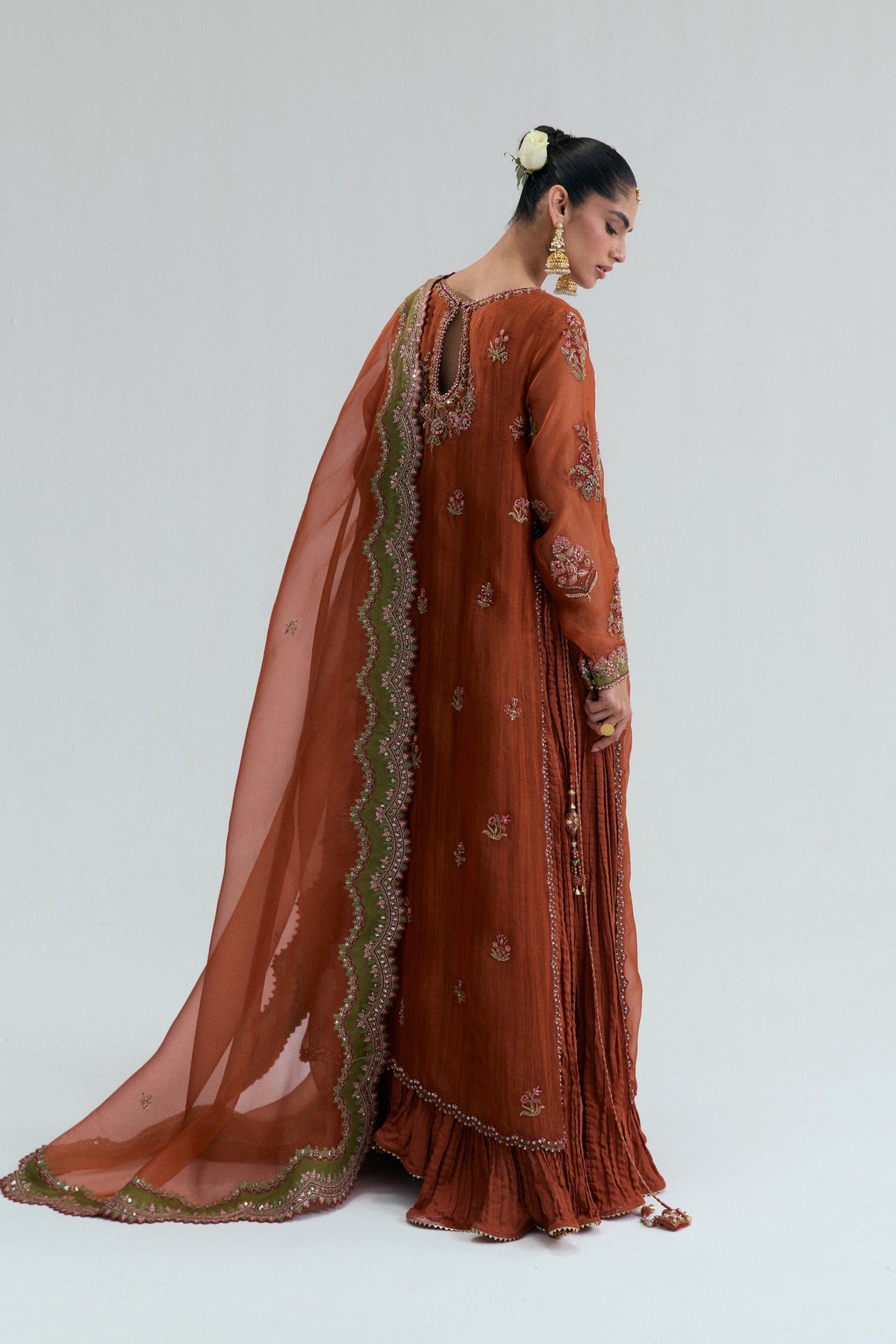 Back of the rust suit showing the keyhole neckline and embroidered yoke detail