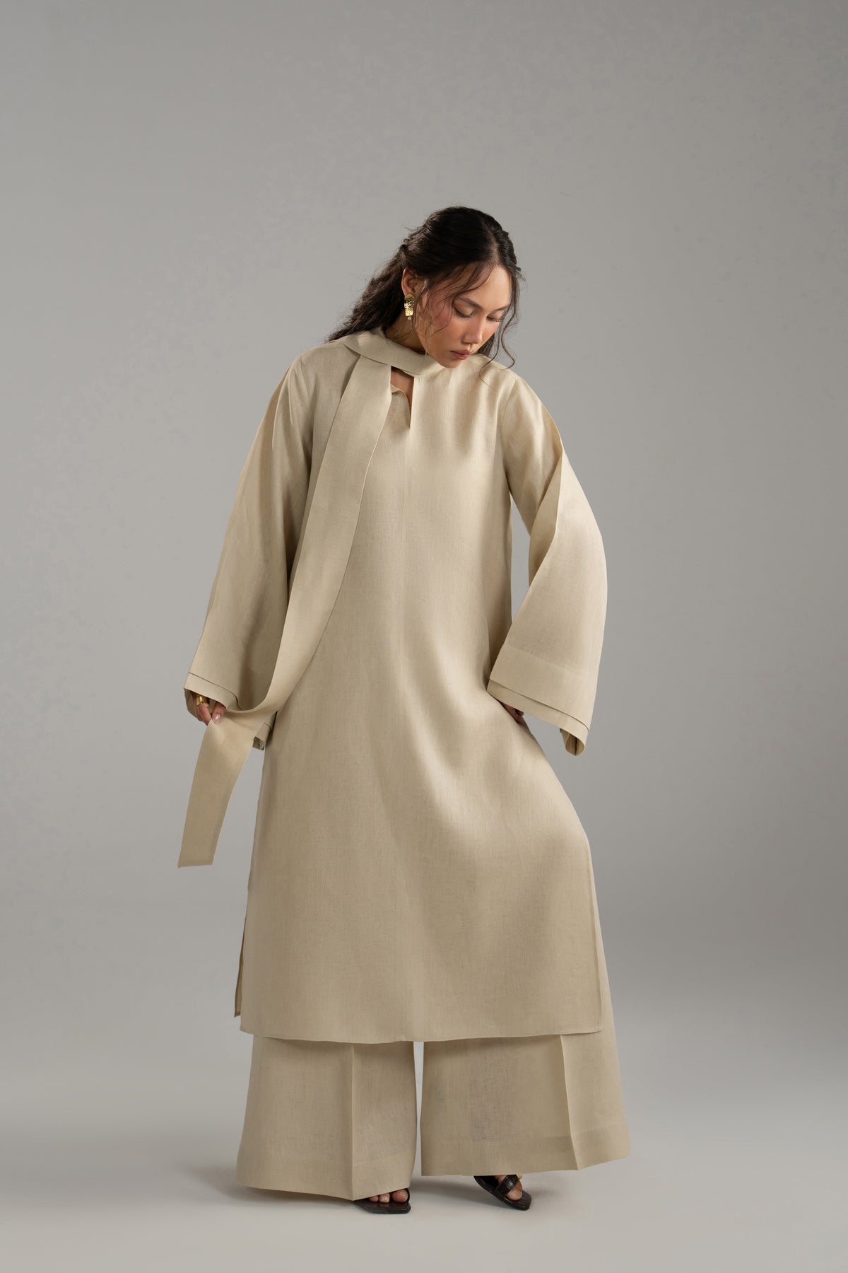 Double-layer bell sleeve on the beige linen tunic, shown with the matching scarf and trousers