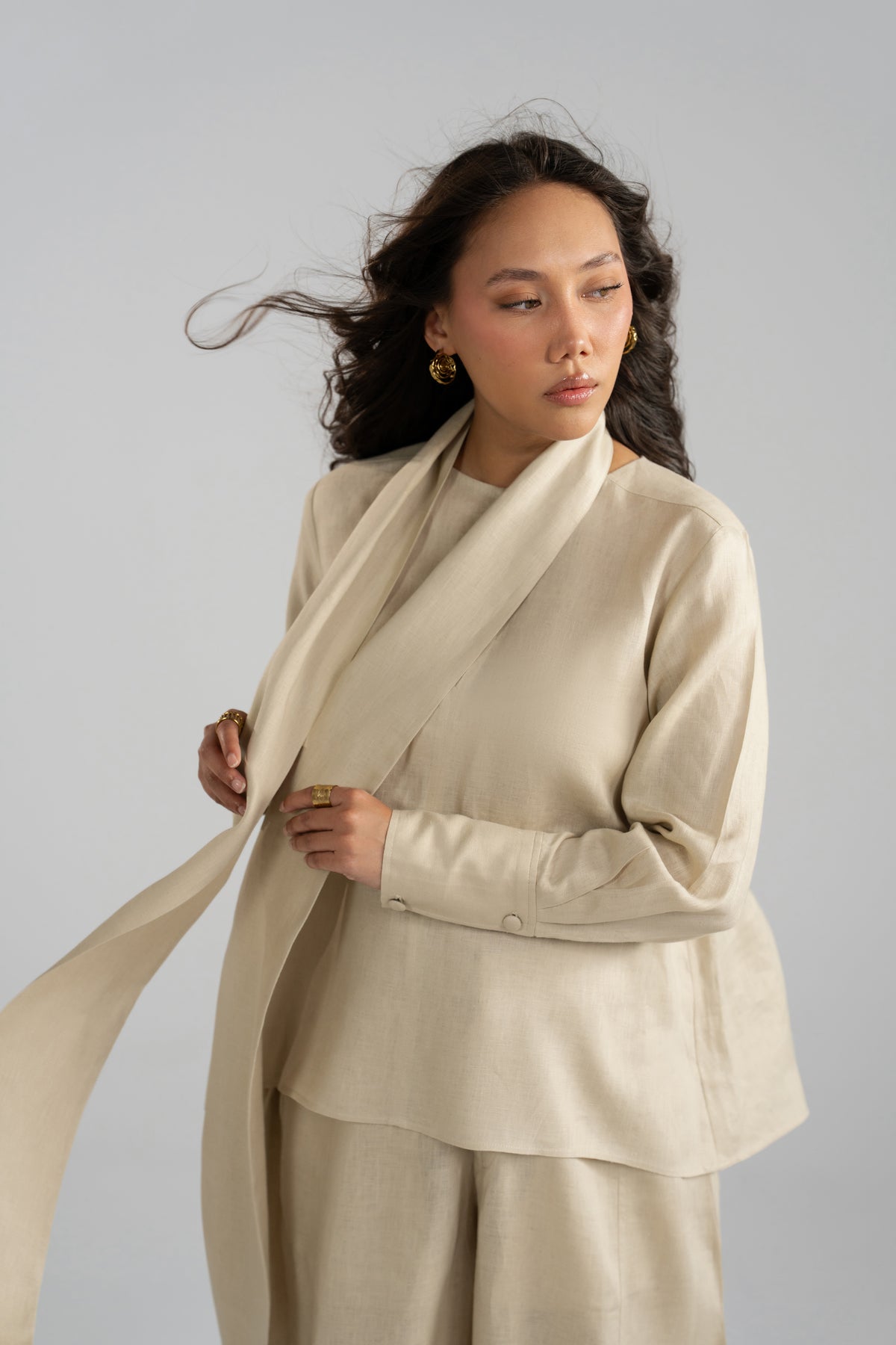Beige pure linen set, showing the long sleeves and loose tunic drape.